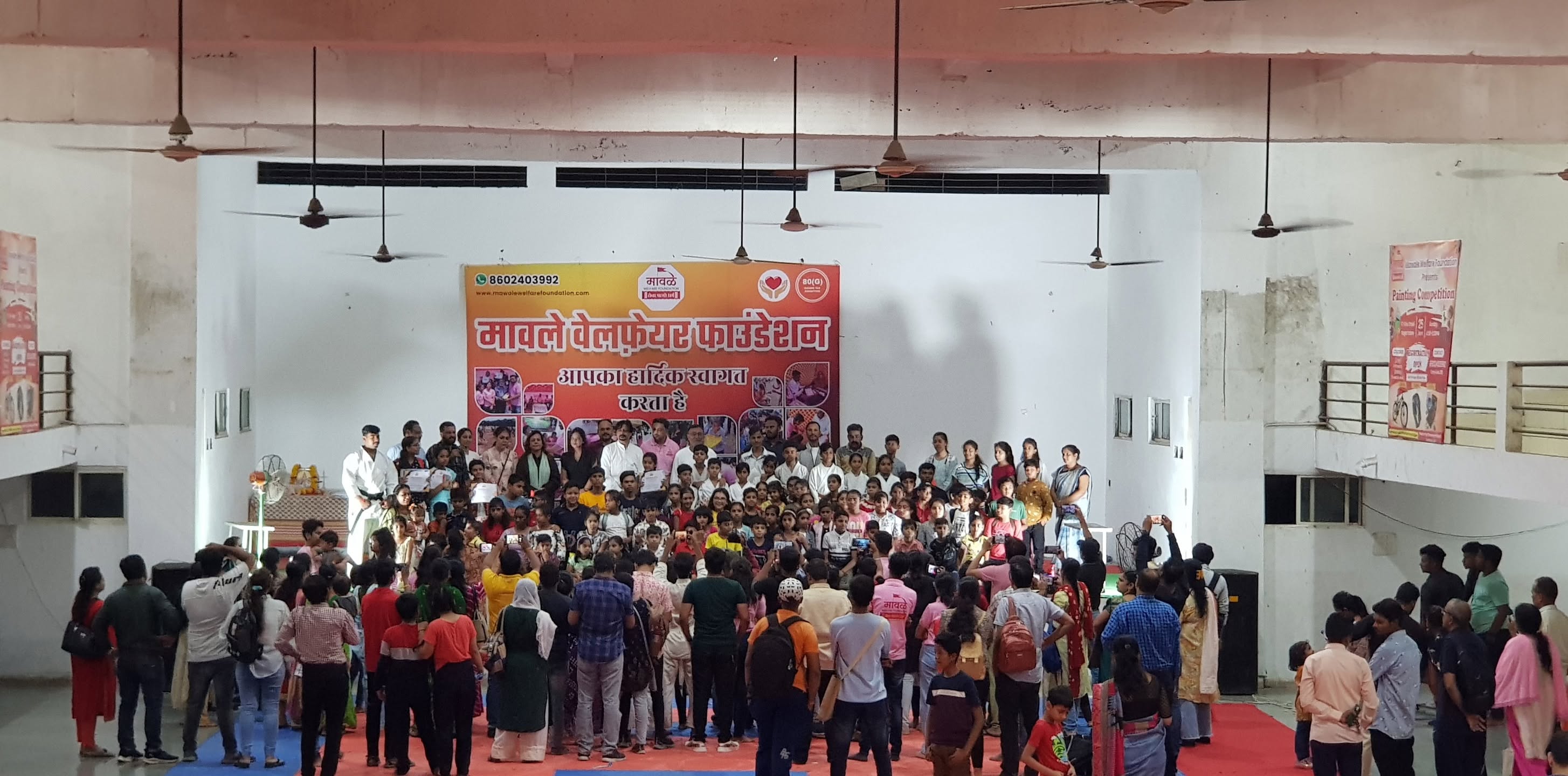 Kids receiving stationery from local volunteers
